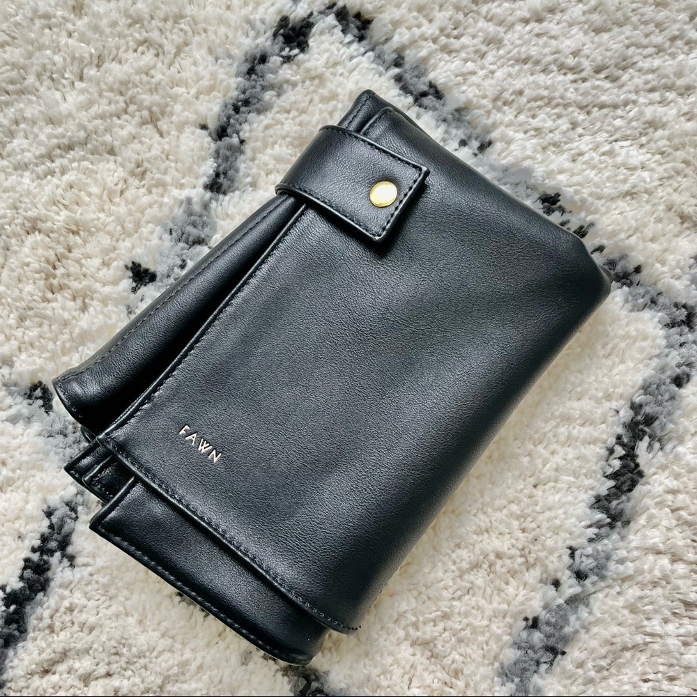 Like new Fawn Design faux leather changing mat